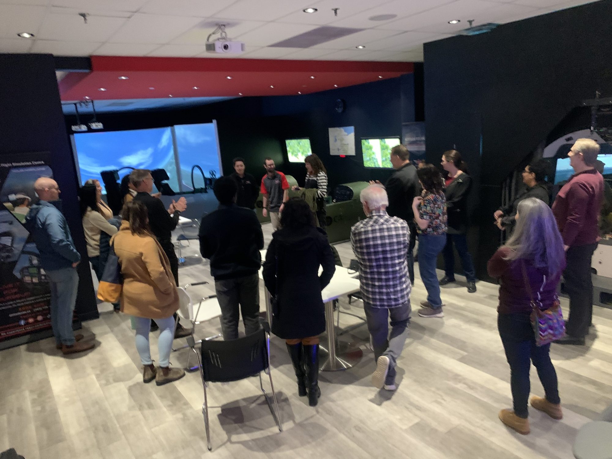 Better Together HOW CALGARY INDOOR ACTIVITIES KEEP EMPLOYEES TOGETHER a group of people standing in a room